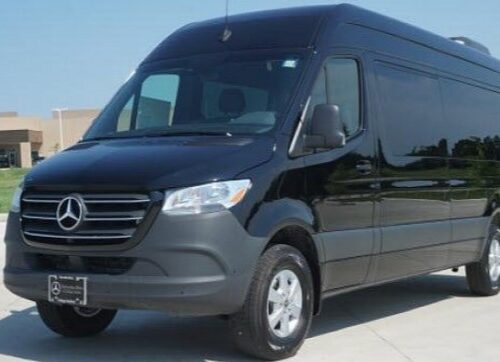 Black Mercedes-Benz Sprinter van parked in a lot, front three-quarter view